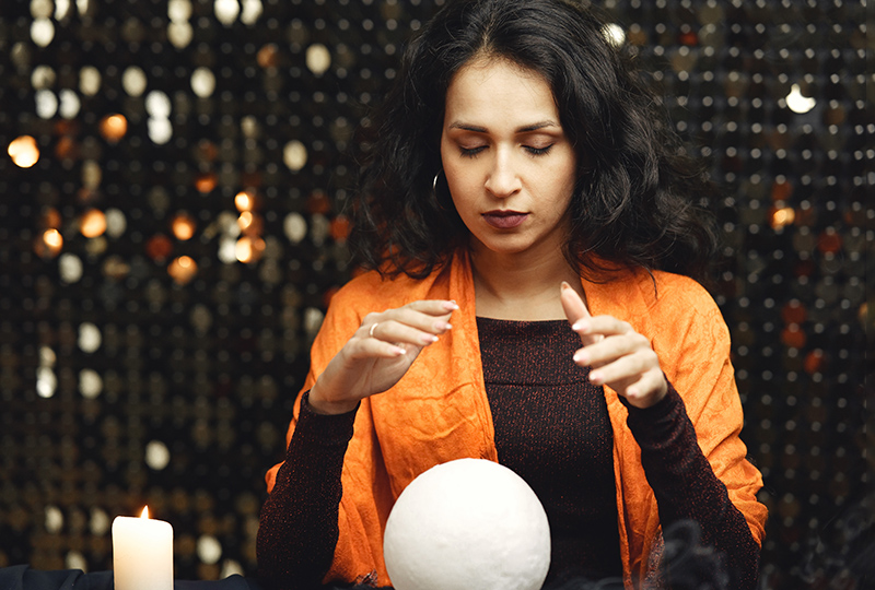 Candles and tarot cards with magic ball